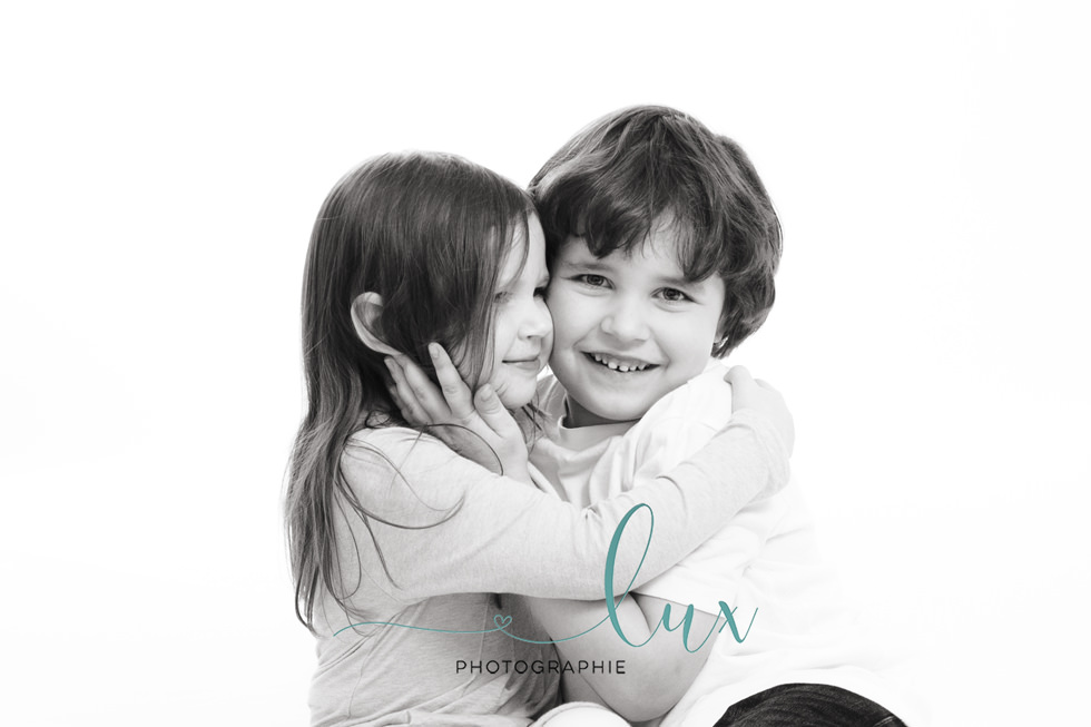 Montreal Children's Photographer. Brother and sister hugging.