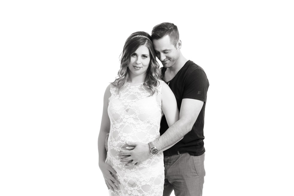 Montreal Maternity Photography. Pregnant woman standing in front of man.