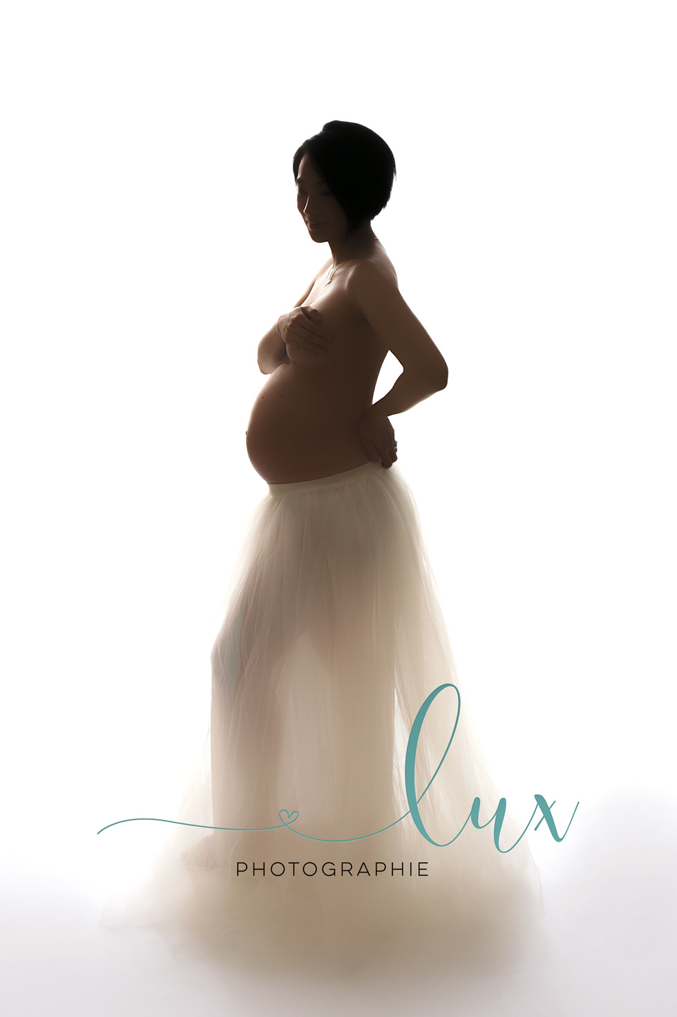 Montreal Maternity Photography. Pregnant woman in cream tutu.