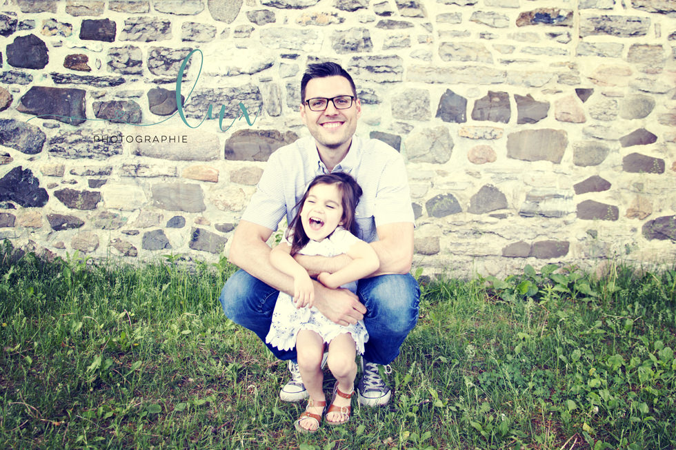 Family photography montreal. Father tickling daughter.