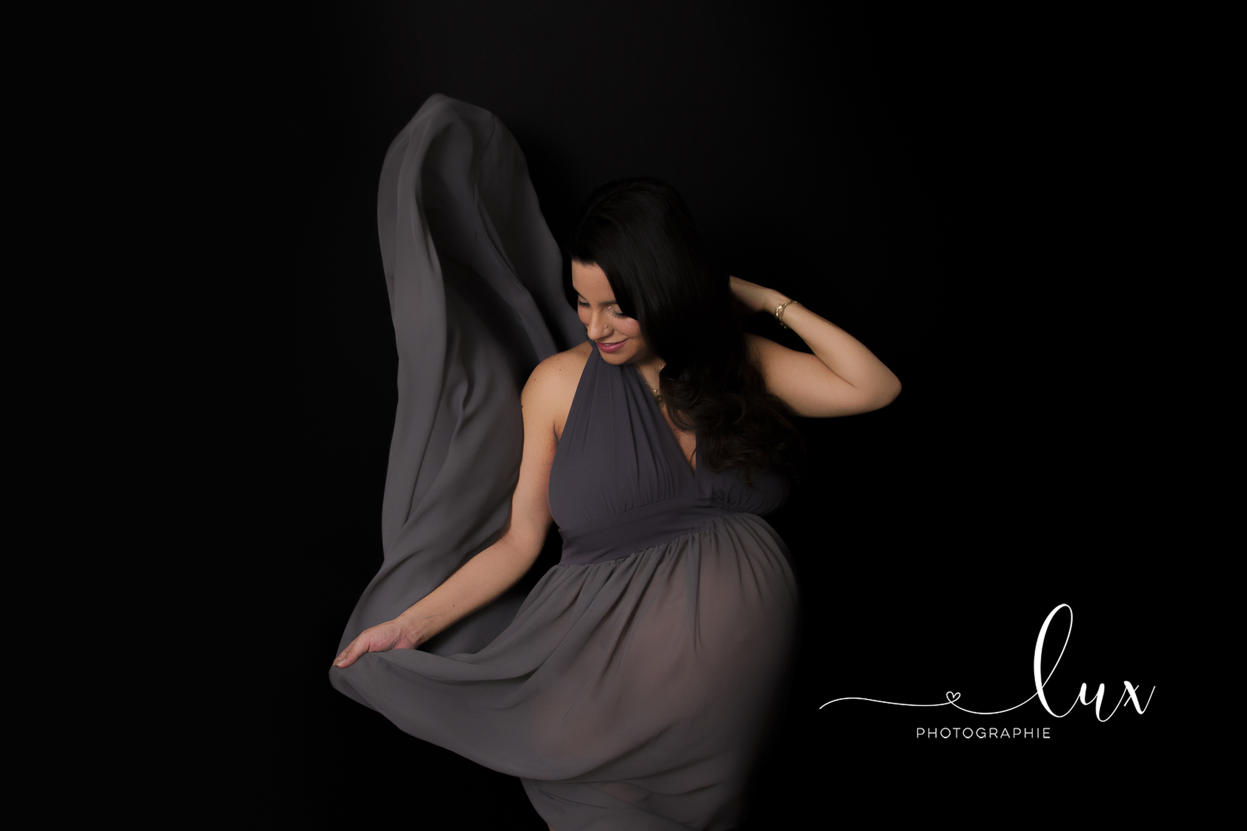 Montreal Maternity Photography. Pregnant woman in grey flowy dress.