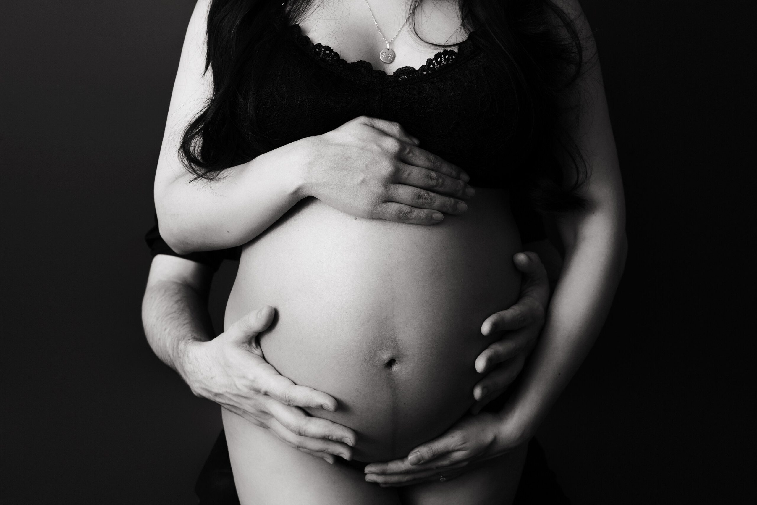 Maternity Photography Montreal. Pregnant belly with mom and dad's hands.